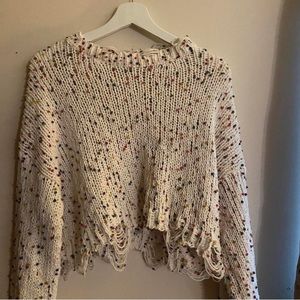confetti sweater with distressing at bottom